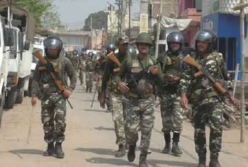 Security personnel conduct flag march in violence hit area in Bihar