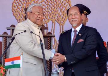 Newly appointed Nagaland CM Neiphiu Rio shakes hands with Nagaland governor PB Acharya after his swearing-in ceremony in Kohima on Thursday