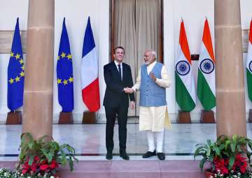 Prime Minister Narendra Modi shakes hands with French President Emmanuel Macron before their meeting at Hyderabad House in New Delhi on Saturday.