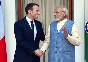 PM Narendra Modi shakes hands with French President Emmanuel Macron before their meeting at Hyderabad House in New Delhi on Saturday.