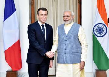 PM Narendra Modi shakes hands with French President Emmanuel Macron before their meeting at Hyderabad House in New Delhi on Saturday.