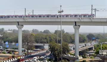 New Delhi: A Metro train moves across the new Majlis Park and Durgabai Deshmukh South Campus Metro section during a media preview in New Delhi