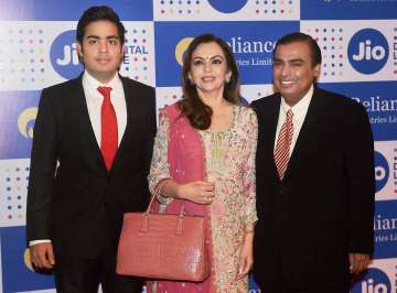 India's richest man Mukesh Ambani with his wife and son