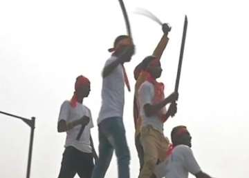 People brandished swords during a rally