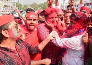 Samajwadi Party supporters celebrate their success in Phulpur and Gorakhpur Lok Sabha by-poll election, in Allahabad on Wednesday.