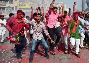  Samajwadi party workers celebrate their party success in Phulpur by-election, in Allahabad on Wednesday.