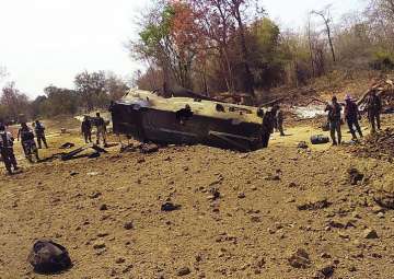 Security personnel inspect the site of an IED blast where nine CRPF personnel were killed and two more were injured after Maoists ambushed them in Kistaram area of Chhattisgarh’s Sukma district on Tuesday. 