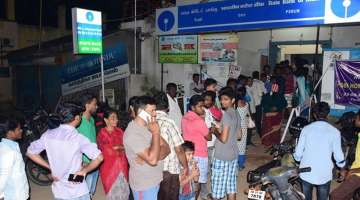  Bhopal: People stand for cash outside at ATM in Bhopal on Tuesday. Most of the ATMs in the city are