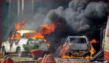 Smoke billows out of burning cars during 'Bharat Bandh' against the alleged 'dilution' of Scheduled Castes/Scheduled Tribes act, in Muzzaffarnagar of UP.