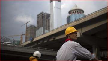 A construction worker at an intersection in Beijing