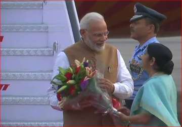 External Affairs minister Sushma Swaraj recieves PM Modi at the airport.