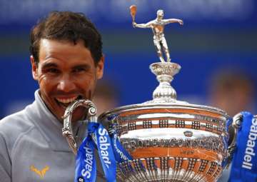 Rafael Nadal poses with his trophy after winning the Barcelona Open