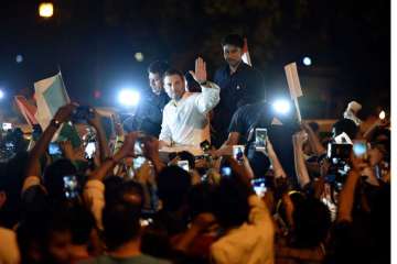 Rahul Gandhi holds midnight candlelight march along with Congress supporters at India Gate.