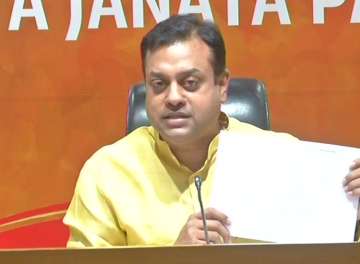 BJP national spokesperson Sambit Patra showing a telegram sourced from Wikileaks during press conference in New Delhi.