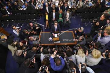 Facebook CEO Mark Zuckerberg arrives to testify before a joint hearing of the Commerce and Judiciary Committees on Capitol Hill in Washington, Tuesday, April 10, 2018, about the use of Facebook data to target American voters in the 2016 election.