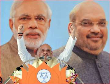 Amit Shah gestures as he addresses a state-level party workers meeting at BHEL Dussehra ground in Bhopal on Friday.