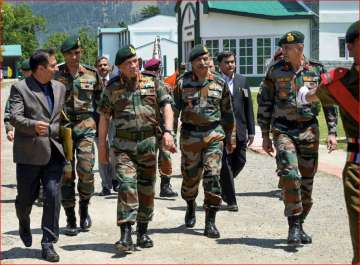 General Bipin Rawat, with 15 Corps Commander Lt General A K Bhatt, takes a round of Army Goodwill Public School, Lidru Pahalgam in Anantnag district of south Kashmir, on Friday.