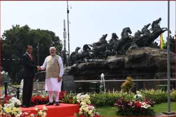 PM Modi with Indonesian President Joko Widodo near Arjuna Wijaya Chariot statue in Central Jakarta