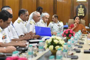 Defence Minister Nirmala Sitharaman at the Naval Commanders' conference in New Delhi on Tuesday. Navy chief Admiral Sunil Lanba is also seen.