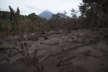 The village of San Miguel Los Lotes stands covered in debris after the Volcan de Fuego or “Volcano of Fire” eruption, in Guatemala, Thursday, June 7, 2018.?