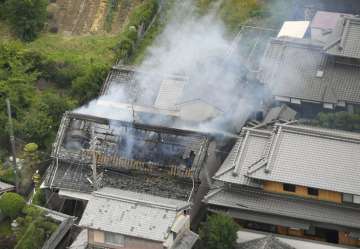 Smoke rises from a house blaze in Takatsuki, Osaka, following an earthquake on Monday.