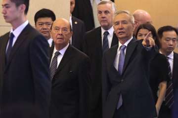 US Commerce Secretary Wilbur Ross, second from left, and Chinese Vice Premier Liu He, right, arrive 