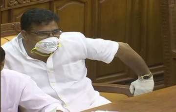  
Kuttiady MLA Parakkal Abdulla wore masks and gloves inside the Kerala Assembly, prompting the ruling front to term the action as a mockery.