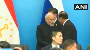 PM Modi, Pak Pres Hussain shake hands at SCO Summit