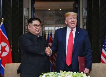 US President Donald Trump with North Korean leader Kim Jong Un during their meeting in Singapore on 