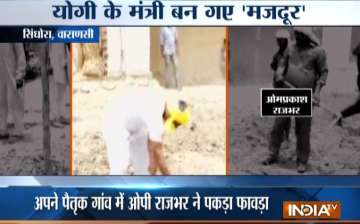 Disappointed by authorities, UP minister picks up shovel to fix road in his village