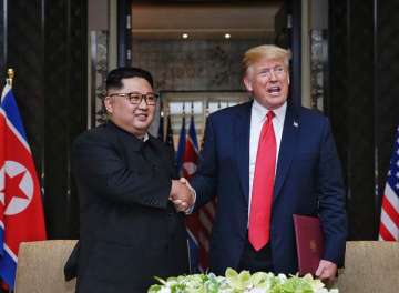 Kim Jong Un and Donald Trump moments after inking the crucial nuclear agreement at the Singapore Summit on Tuesday