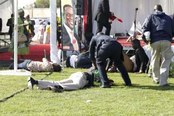 Footage circulating on social media showed an explosion and plumes of smoke around the president as he descended stairs from the podium at the White City stadium.?