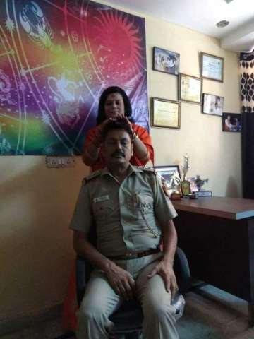 Delhi cop transferred after photo with godwoman 'blessing' him goes with viral?