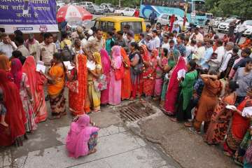 Pilgrims wait in queues to get themselves registered for Amarnath Yatra, in Jammu on Tuesday.