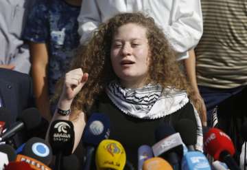 Ahed Tamimi speaks during a press conference on the outskirts of the West Bank village of Nabi Saleh near the West Bank city of Ramallah, Sunday, July 29