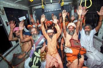 Sadhus chant religious slogans as they resume their Amarnath yatra after it was suspended due to bad weather, in Jammu on Sunday.