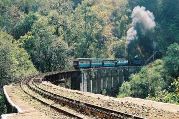 The train service is a major tourist attraction as it winds its way through picturesque valleys and has been accorded World Heritage Status by UNESCO.