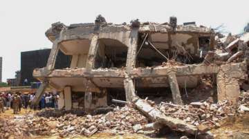 Greater Noida: Rescue works underway at the site of the collapsed building at Shahberi village, in Greater Noida (West) on Wednesday