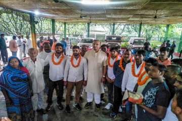 ?Union Minister of State for Civil Aviation Jayant Sinha with the lynching convicts at his residence after they were released on bail in Ramgarh, Jharkhand .