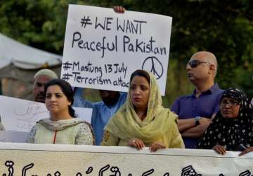 Members of a civil society hold a demonstration to condemn Friday’s deadliest suicide bombing, in Islamabad, Pakistan on Saturday.?