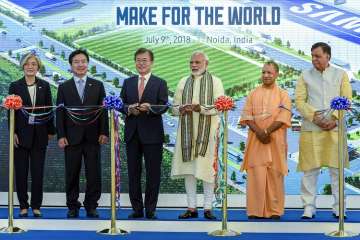 ?
Prime Minister Narendra Modi with South Korean President Moon Jae-in, Uttar Pradesh Chief Minister Yogi Adityanath and other delegates at the inauguration ceremony of world's largest mobile phone manufacturing facility, in Noida on Monday.
?