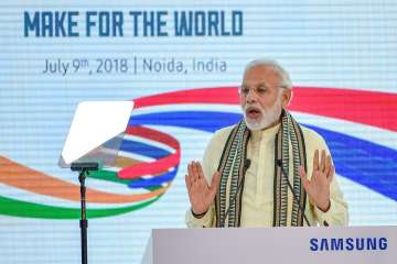 Prime Minister Narendra Modi addresses at the inauguration ceremony of Samsung mobile factory, in Noida.