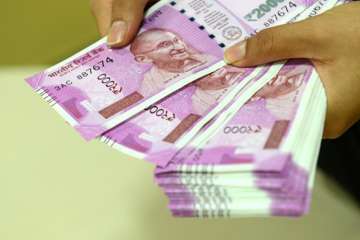 Rupee plunged to a record low of 69.12 against US dollar