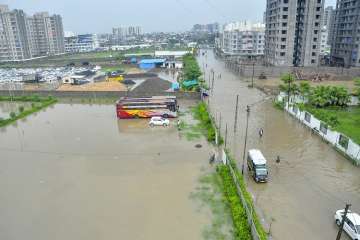 A view of a flooded locality after heavy rains, in Surat on Monday.