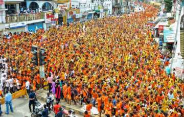 ?
?
Hindu devotees (Kanwariyas) carry holy water to perform 'abhishek' during the holy month of Sawan, in Jabalpur on Monday