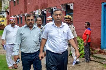 Officials arrives for an investigation, in Deoria on Monday.
