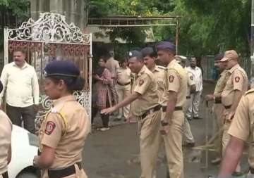 Visuals outside Pune court, where?Sachin Andure was produced today.