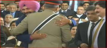Sidhu hugs Pak army chief at Imran Khan's swearing-in