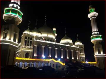 Vehicles are parked outside the Grand Mosque in Weizhou in northwestern China’s Ningxia Hui Autonomous Region