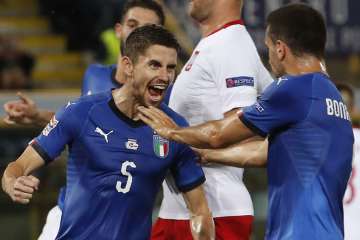 Italy midfielder Jorginho celebrates after converting a late penalty.